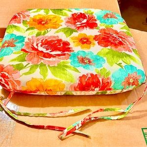 12 chair pads with floral design.$8 each or $95 for all